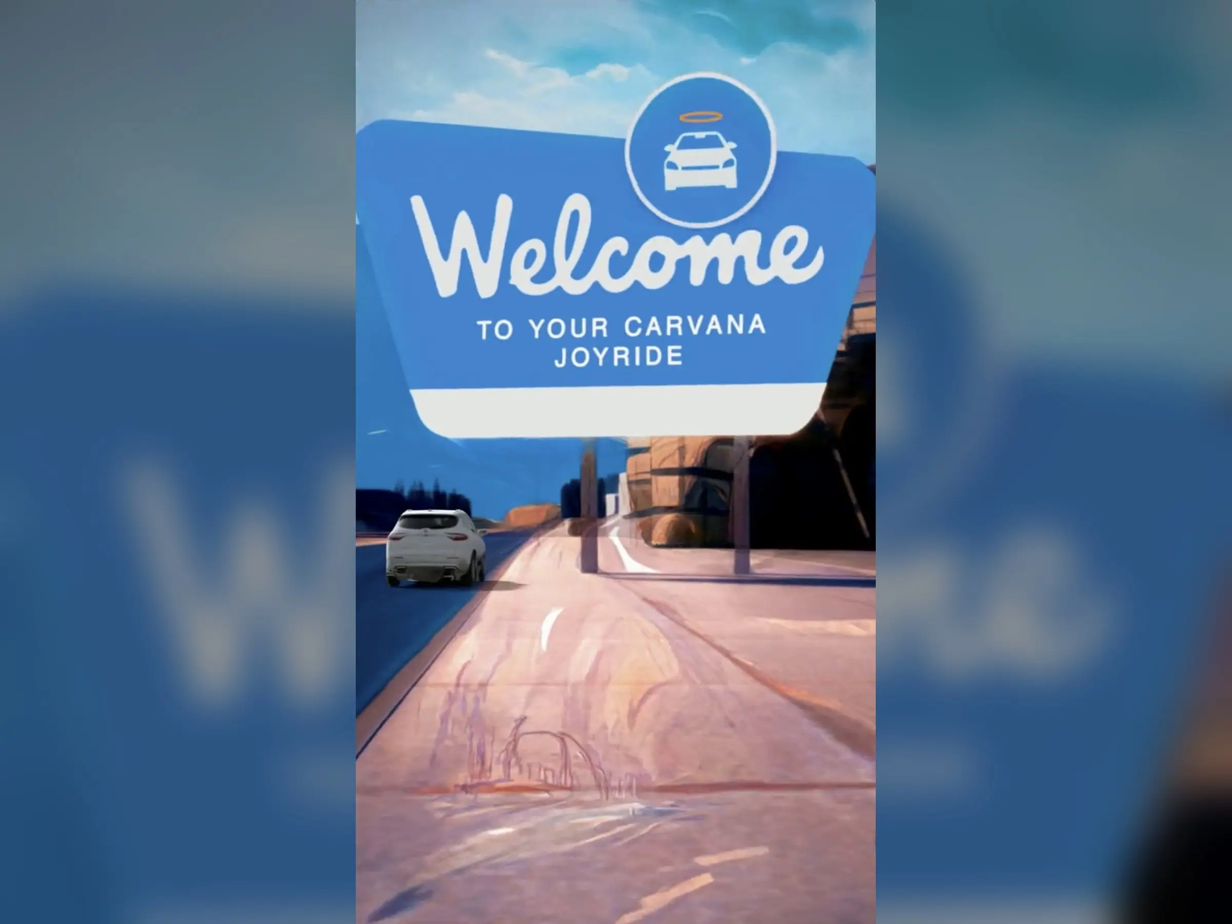 The final frame of a video: a sign that reads Welcome to your Carvana Joyride beside the road.