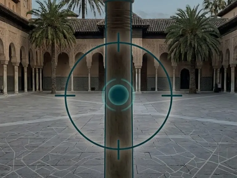 The AR view in a courtyard with palm trees and arcades, with a target ring on the paving.